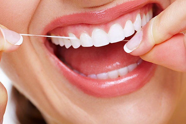Woman flossing